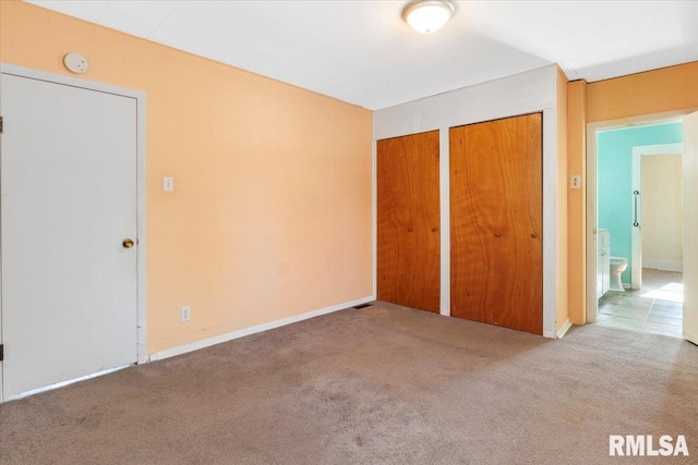 unfurnished bedroom featuring carpet