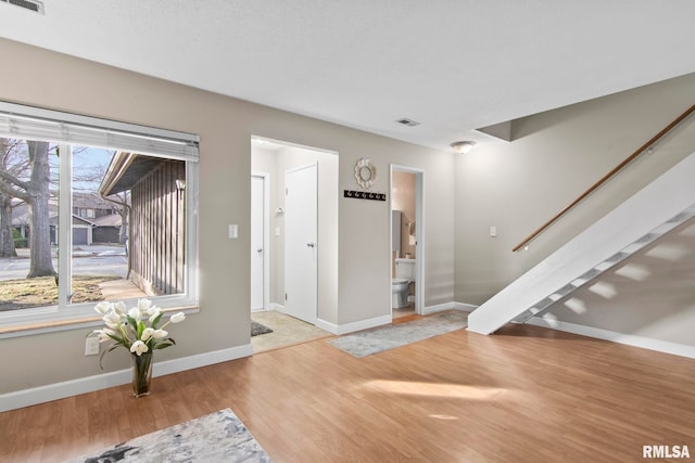 entryway with light hardwood / wood-style floors