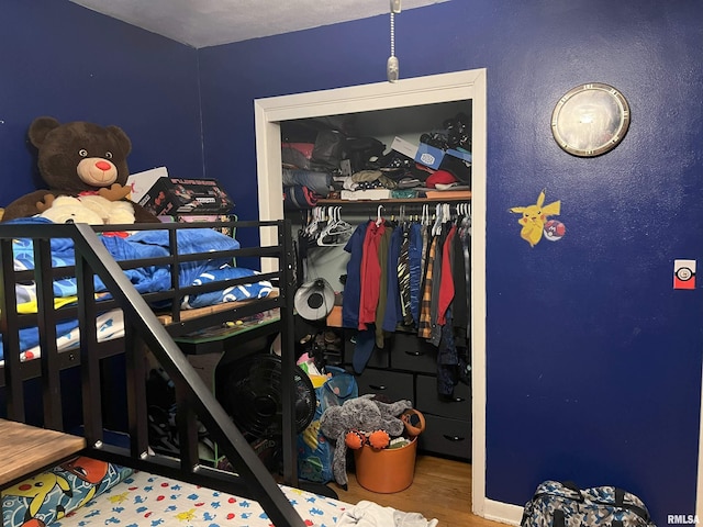 238 E Prairie St, Roodhouse, IL 62082 - bedroom featuring hardwood / wood-style flooring and a closet