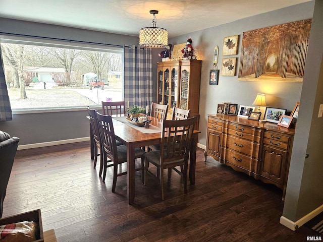 dining room with dark hardwood / wood-style flooring