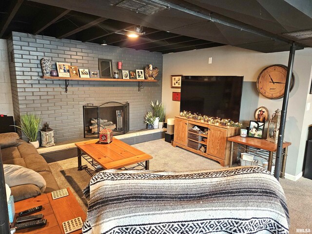 carpeted living room featuring a brick fireplace