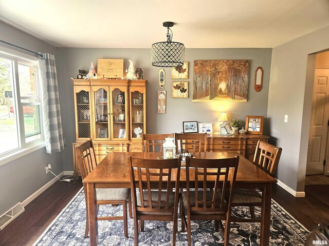 dining space featuring dark hardwood / wood-style flooring