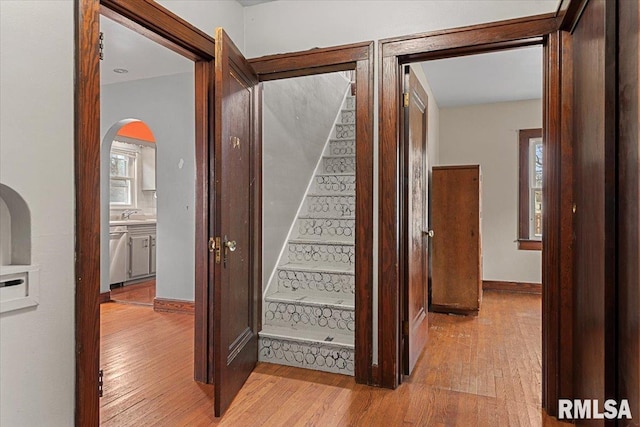 stairway featuring wood-type flooring