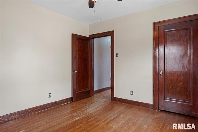 unfurnished bedroom with hardwood / wood-style flooring and ceiling fan