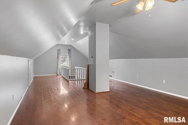 bonus room with dark wood-type flooring, ceiling fan, and vaulted ceiling