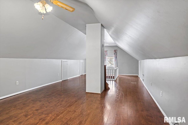 bonus room with ceiling fan, lofted ceiling, and dark hardwood / wood-style flooring