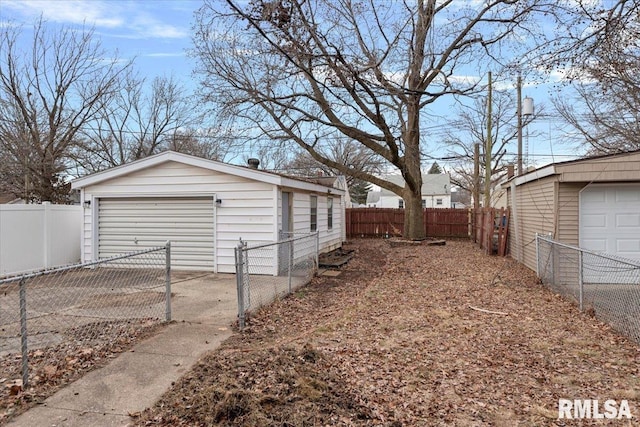 view of property exterior featuring a garage and an outdoor structure