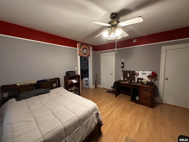 bedroom with ceiling fan and light hardwood / wood-style floors