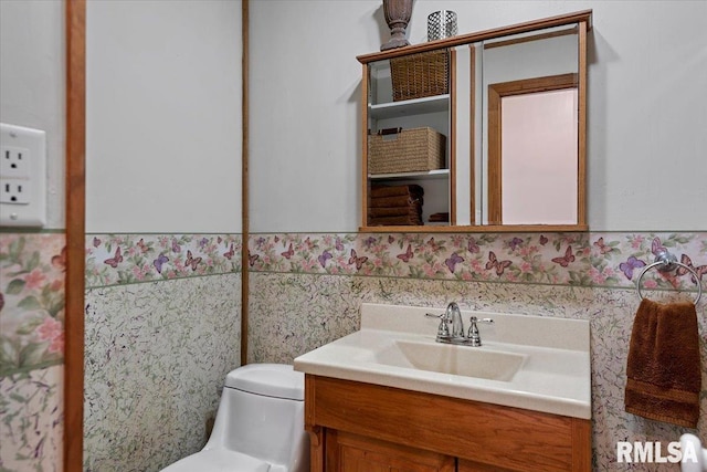 bathroom with vanity and toilet