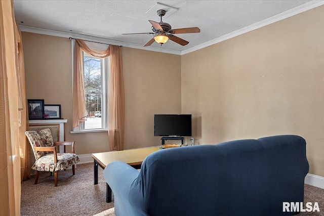 living room featuring ornamental molding, carpet flooring, a textured ceiling, and ceiling fan