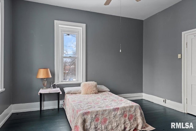 bedroom featuring ceiling fan and dark hardwood / wood-style flooring