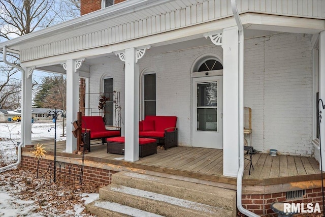 view of snow covered property entrance