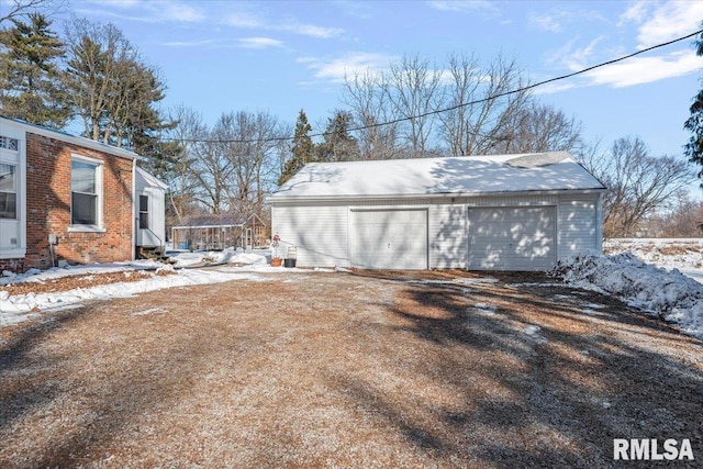 view of snow covered garage