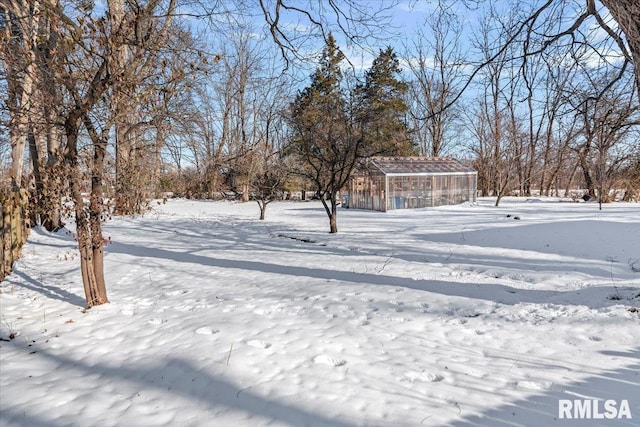 view of yard layered in snow