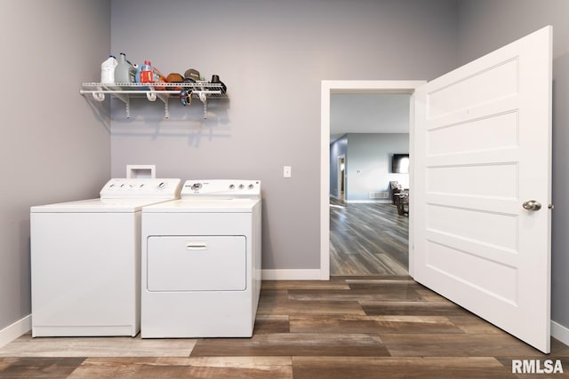 washroom featuring dark hardwood / wood-style flooring and washer and dryer