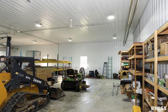 garage with ceiling fan and a workshop area