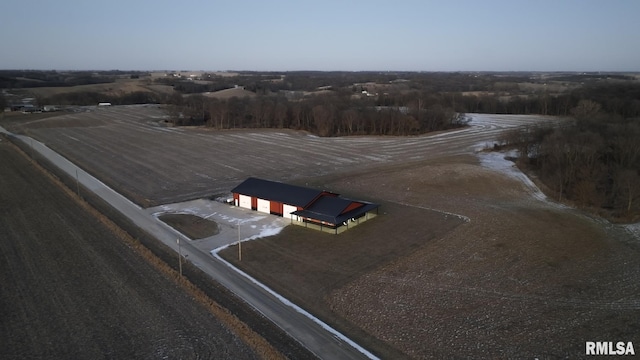 birds eye view of property with a rural view