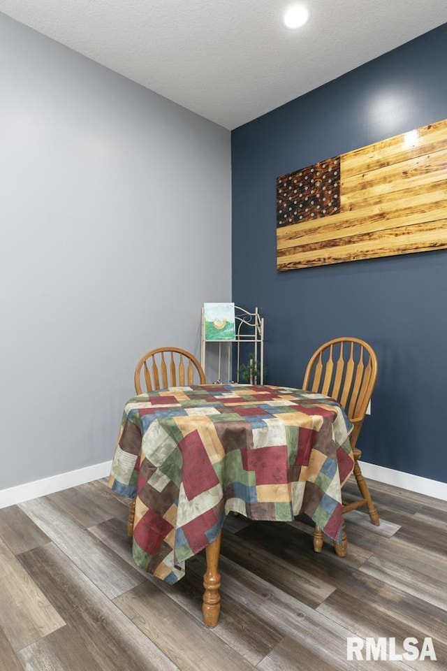 dining area featuring wood-type flooring