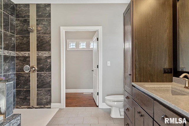 bathroom with tile patterned floors, toilet, and vanity