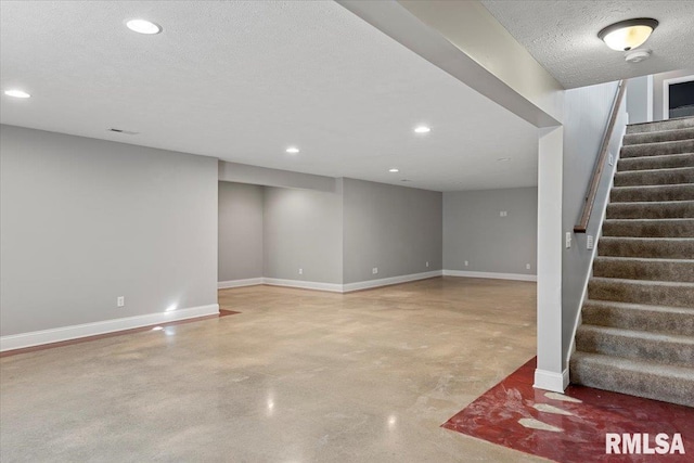 basement with a textured ceiling