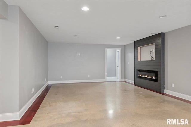 unfurnished living room with a large fireplace