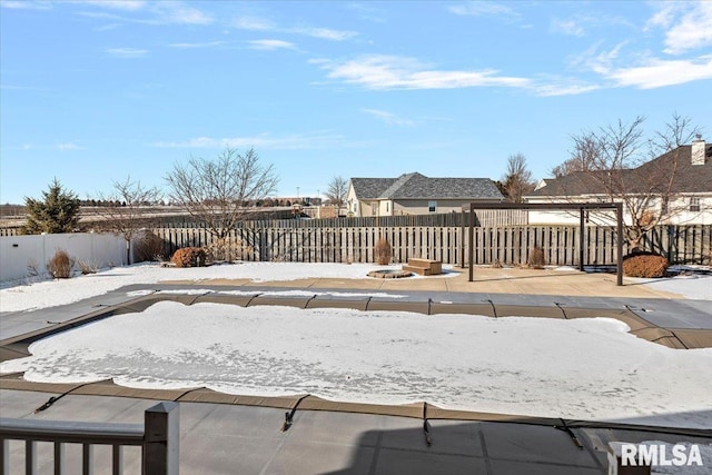 view of snow covered pool