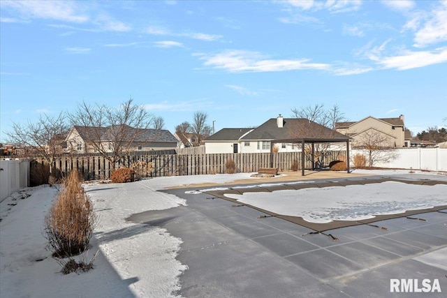 view of snow covered pool