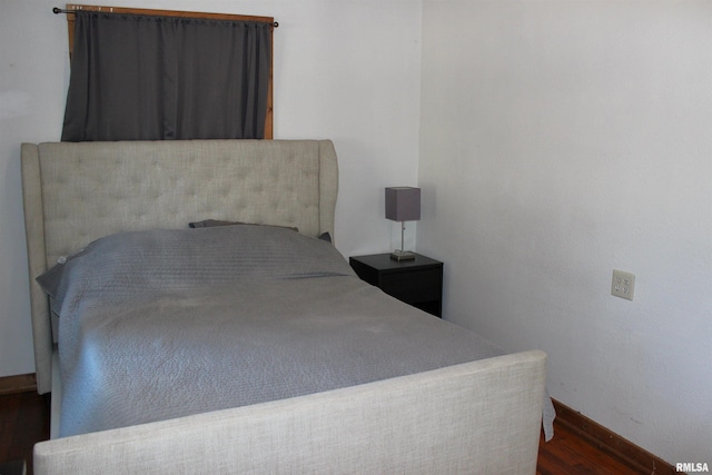 bedroom featuring dark hardwood / wood-style floors