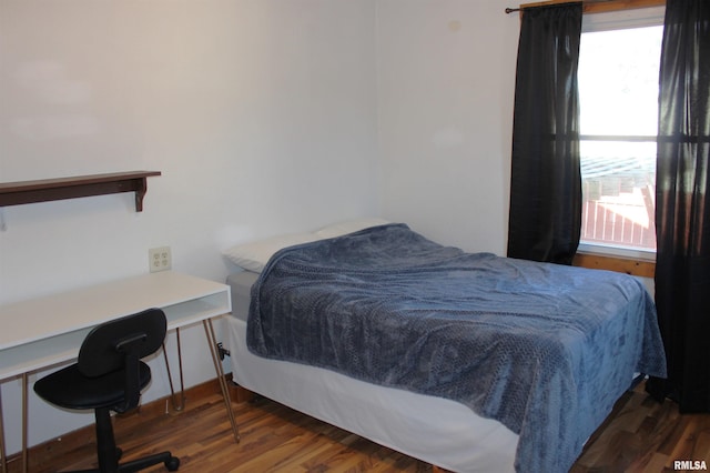 bedroom featuring dark hardwood / wood-style flooring