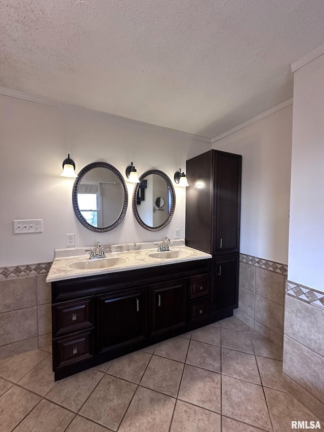 bathroom featuring tile walls, tile patterned floors, and a textured ceiling