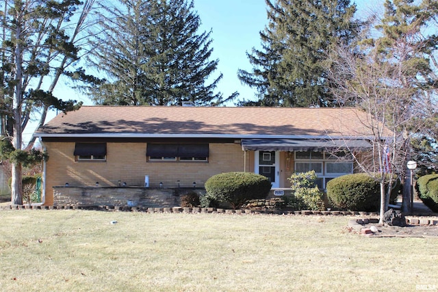 ranch-style home with a front yard