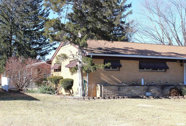 view of property exterior with a yard