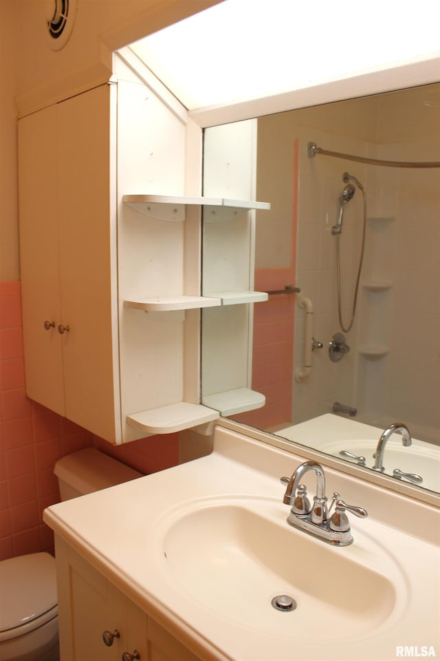 bathroom with vanity, walk in shower, and toilet