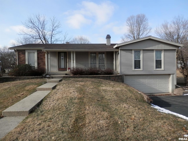 ranch-style house featuring a front lawn, a chimney, and an attached garage