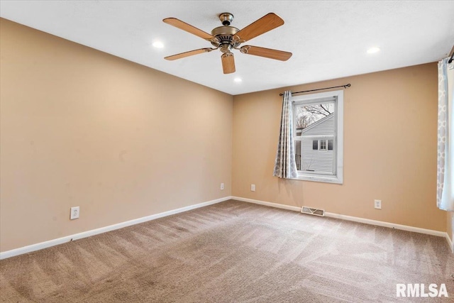 carpeted empty room with ceiling fan