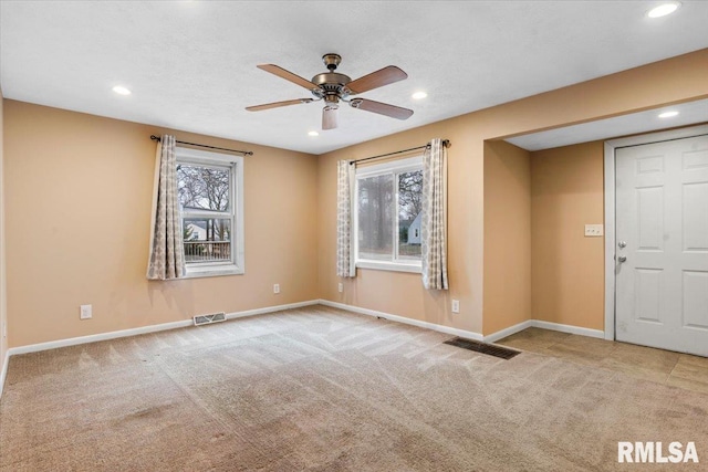 interior space with ceiling fan and a wealth of natural light