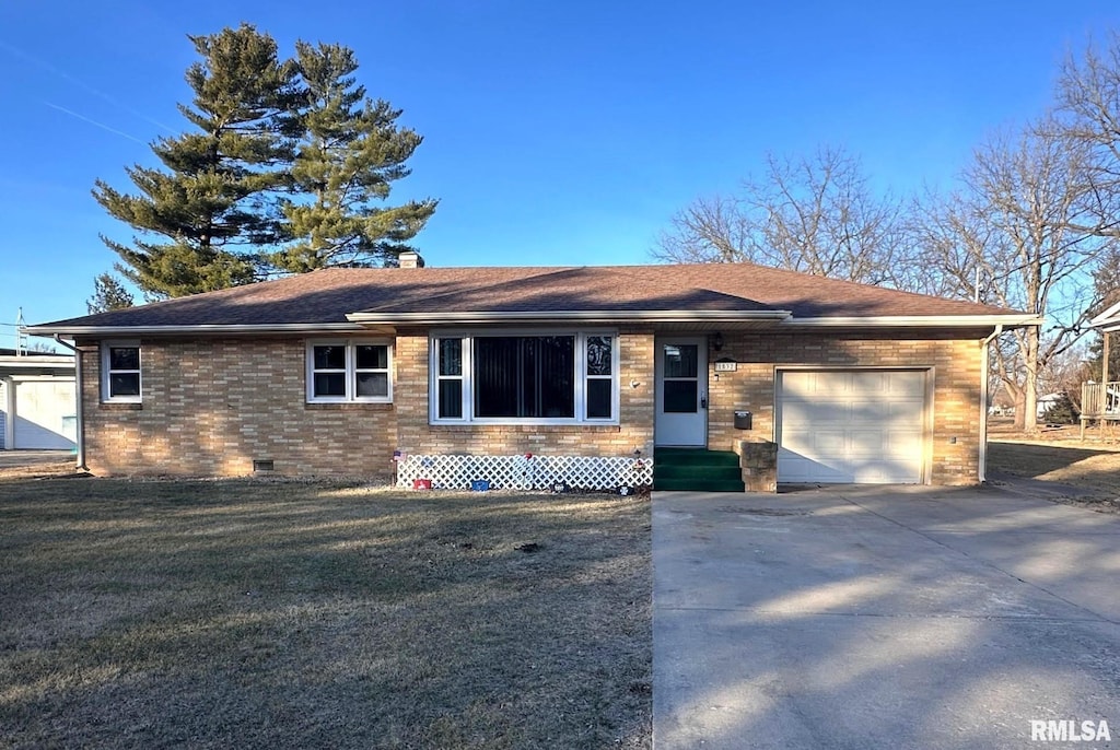 ranch-style house with a garage and a front yard