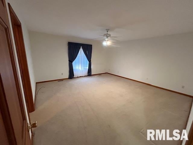 carpeted empty room with ceiling fan