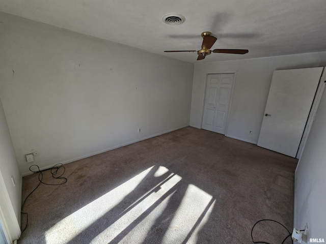 unfurnished bedroom with a closet, ceiling fan, and carpet