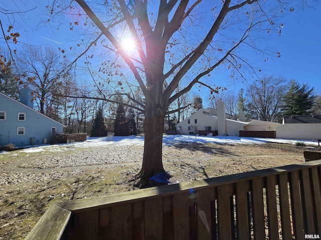 view of yard layered in snow