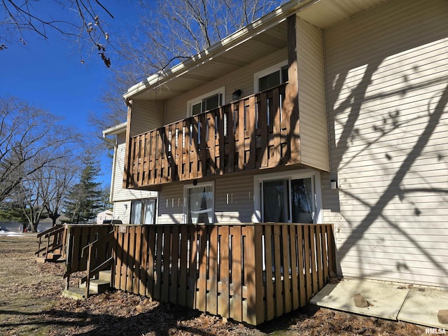 back of house with a balcony