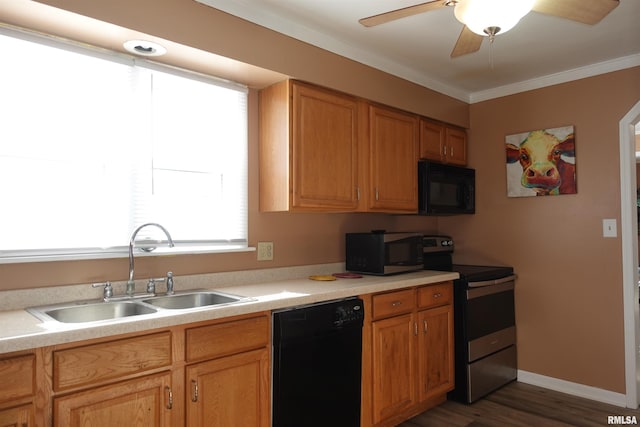 kitchen featuring sink, ornamental molding, dark hardwood / wood-style flooring, ceiling fan, and black appliances