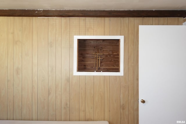 details featuring wood walls