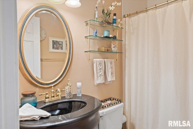 bathroom with sink and toilet