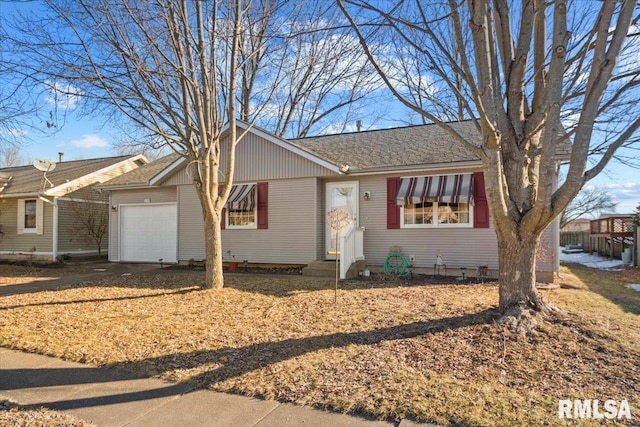 single story home featuring a garage