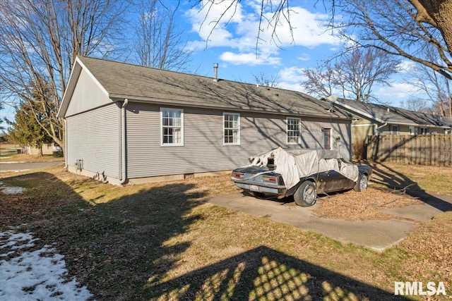 rear view of house with a yard