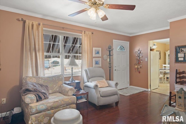 living room featuring dark hardwood / wood-style flooring, crown molding, and ceiling fan