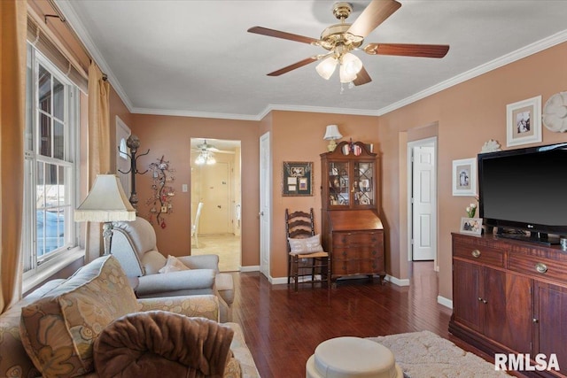 living room featuring dark hardwood / wood-style flooring, crown molding, and ceiling fan