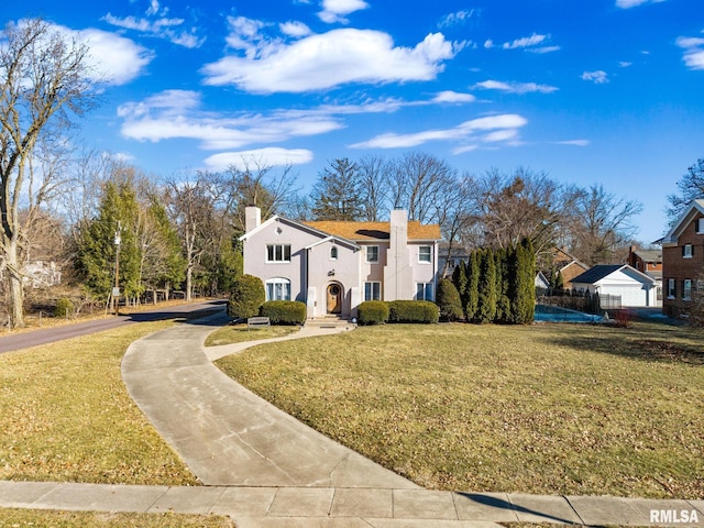 view of front of property with a front lawn