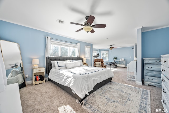 bedroom featuring ceiling fan, ornamental molding, and light carpet